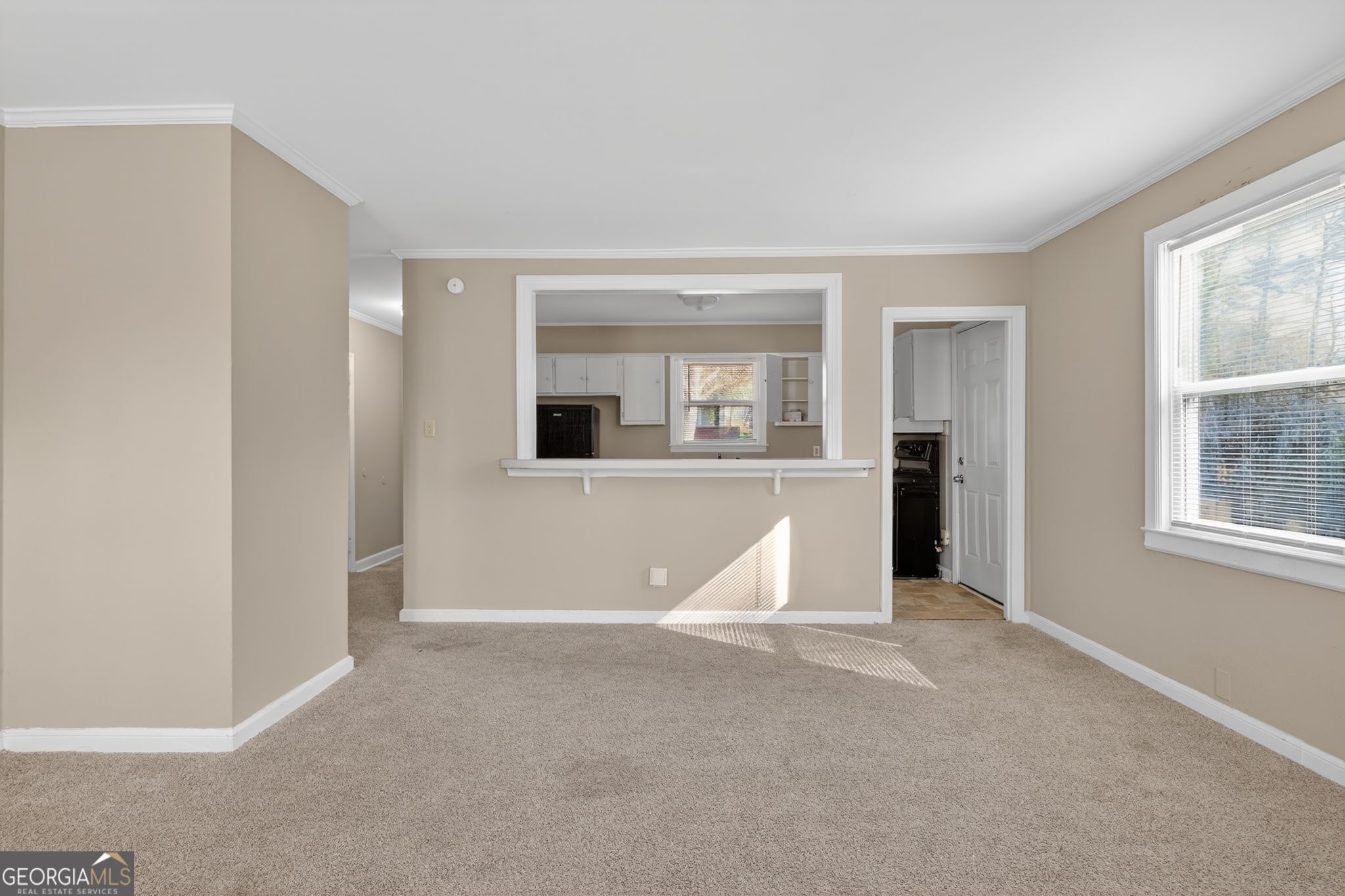 2835 Fairmount Street Augusta, GA 30906 - Photo 6 of 30 an empty room with kitchen view and windows