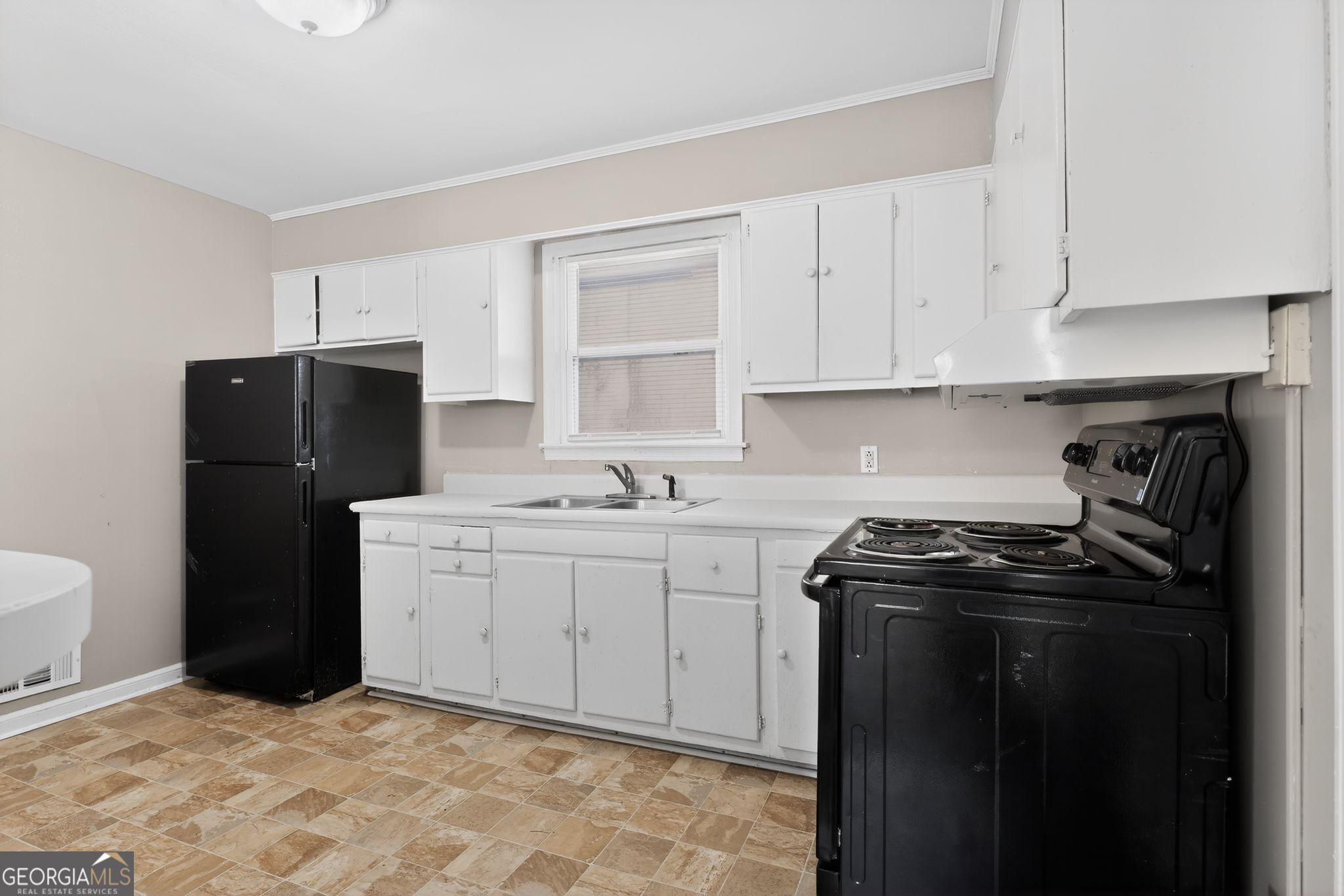 2835 Fairmount Street Augusta, GA 30906 - Photo 7 of 30 a kitchen with a sink stove and refrigerator