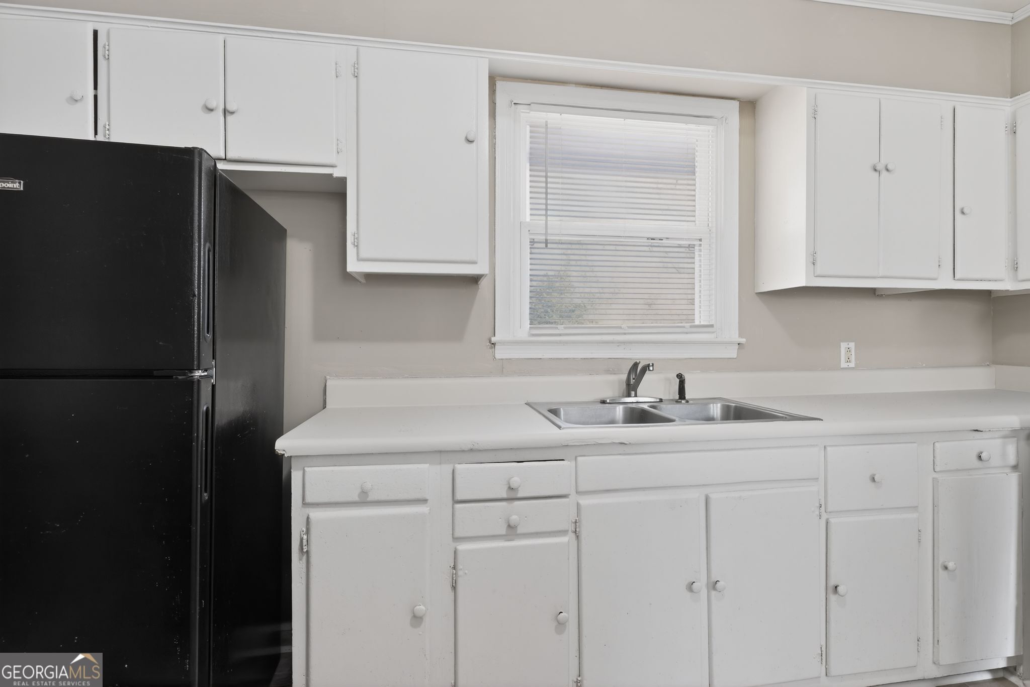 2835 Fairmount Street Augusta, GA 30906 - Photo 9 of 30 a kitchen with a sink and a refrigerator