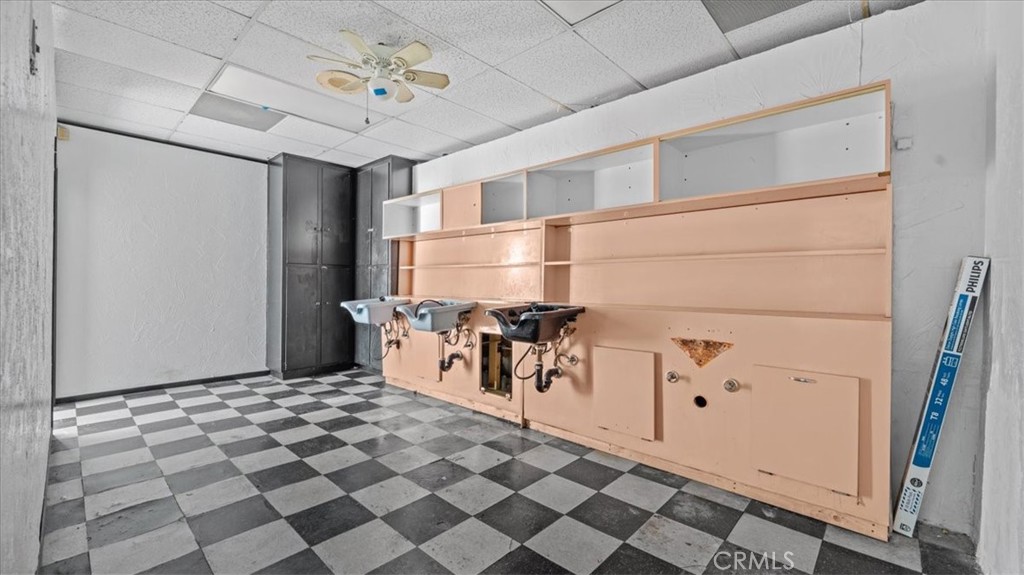 106 North Riverside Avenue Rialto, CA 92376 - Photo 13 of 18 a very nice looking room with a black white checkered floor