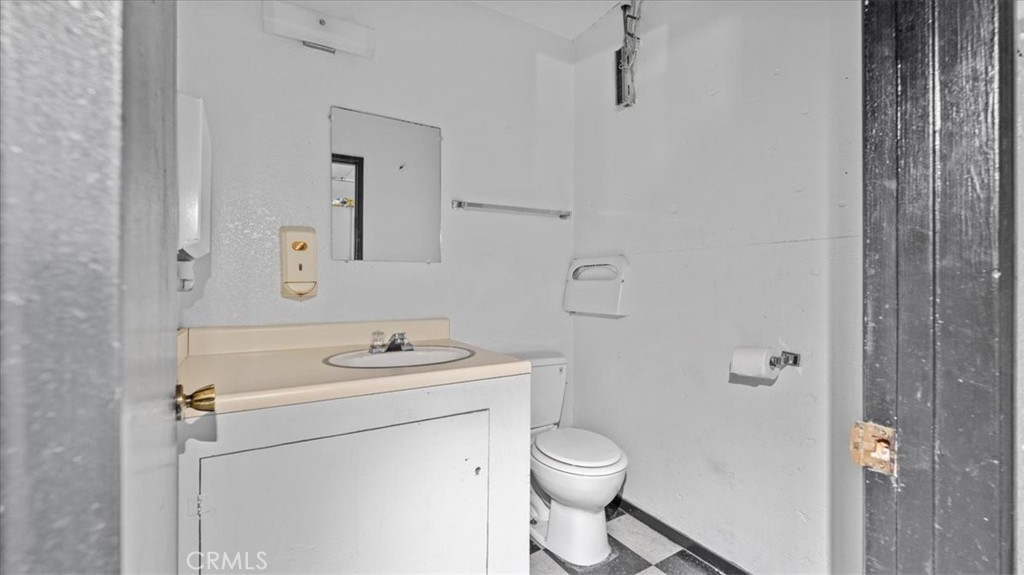 106 North Riverside Avenue Rialto, CA 92376 - Photo 18 of 18 a bathroom with a sink a toilet and shower