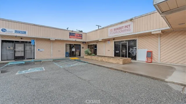 a view of a house with a parking space