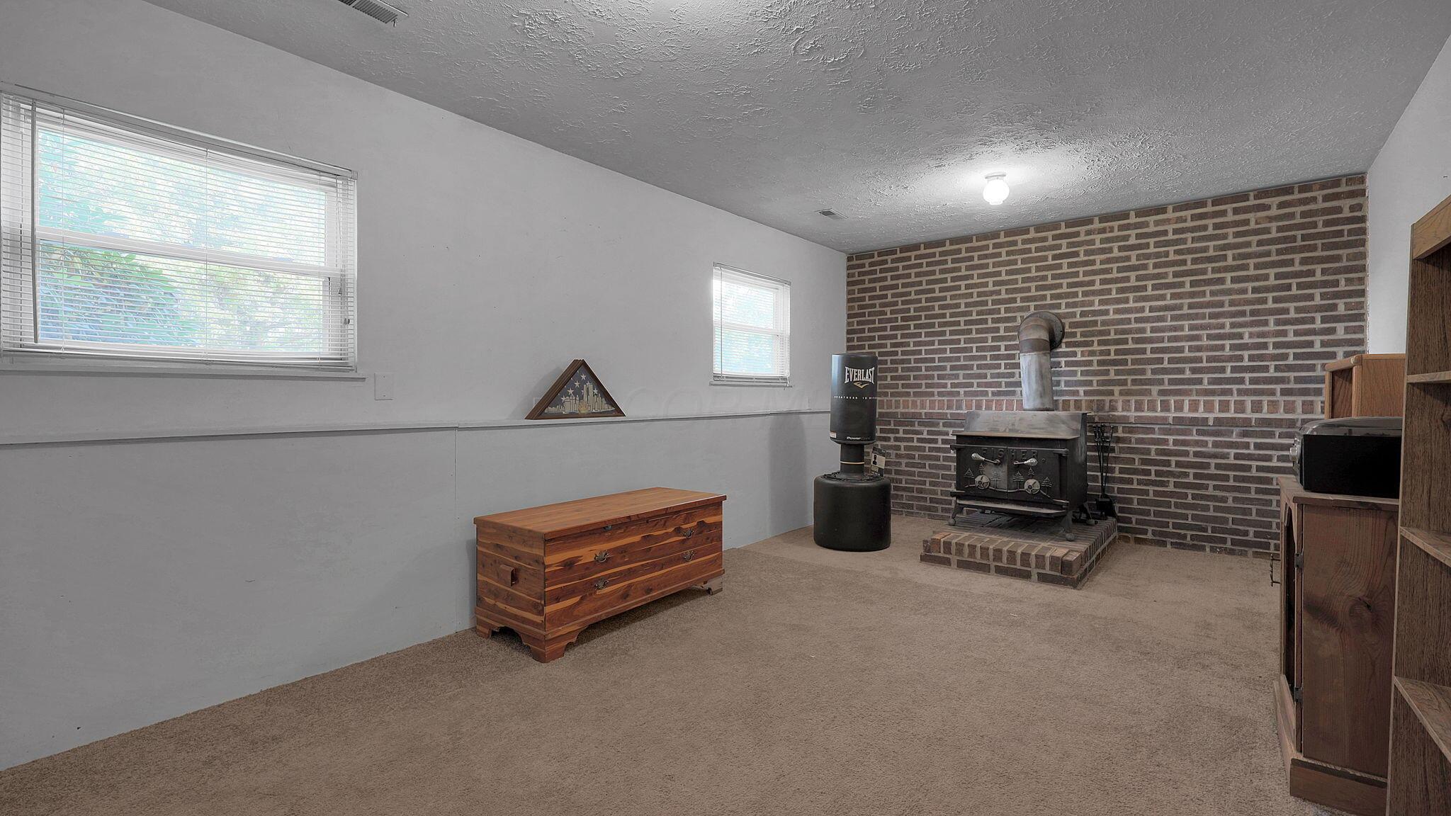 14221 Edwards Road Johnstown, OH 43031 - Photo 17 of 45 Wood-burning stove adds extra warmth in the winter.