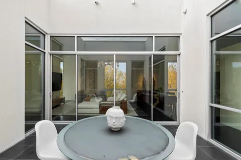 a dining room with table and chairs