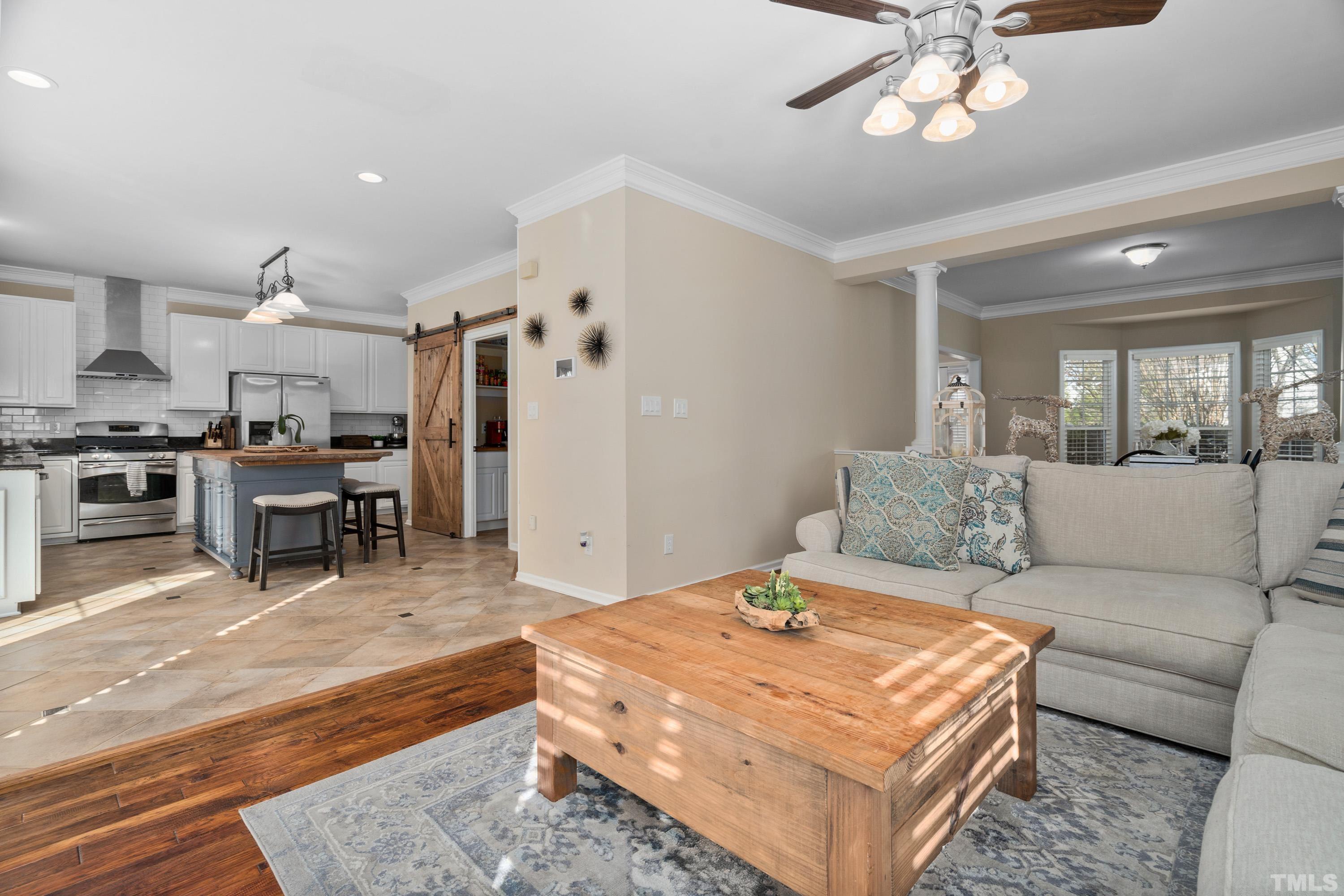 7405 Dorrington Trail Raleigh, NC 27615 - Photo 11 of 31 a living room with furniture and kitchen view