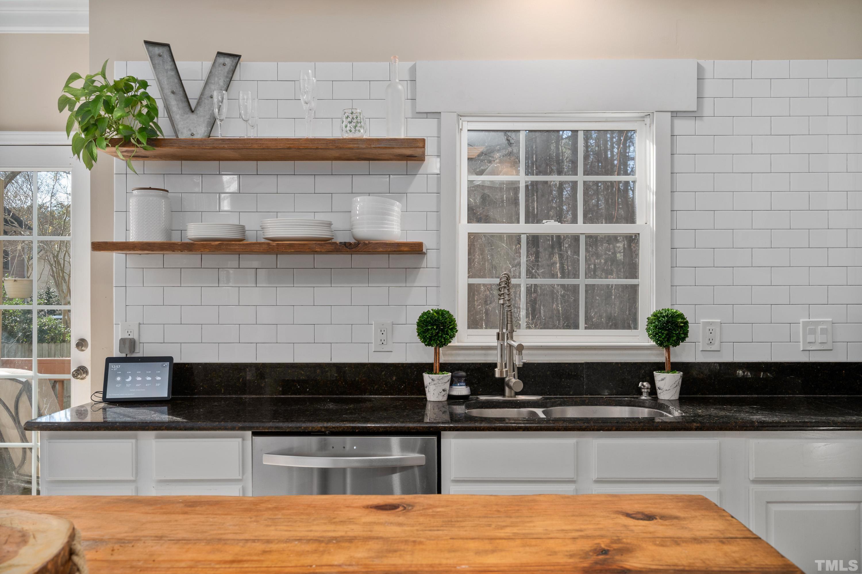 7405 Dorrington Trail Raleigh, NC 27615 - Photo 15 of 31 a kitchen with a sink and window