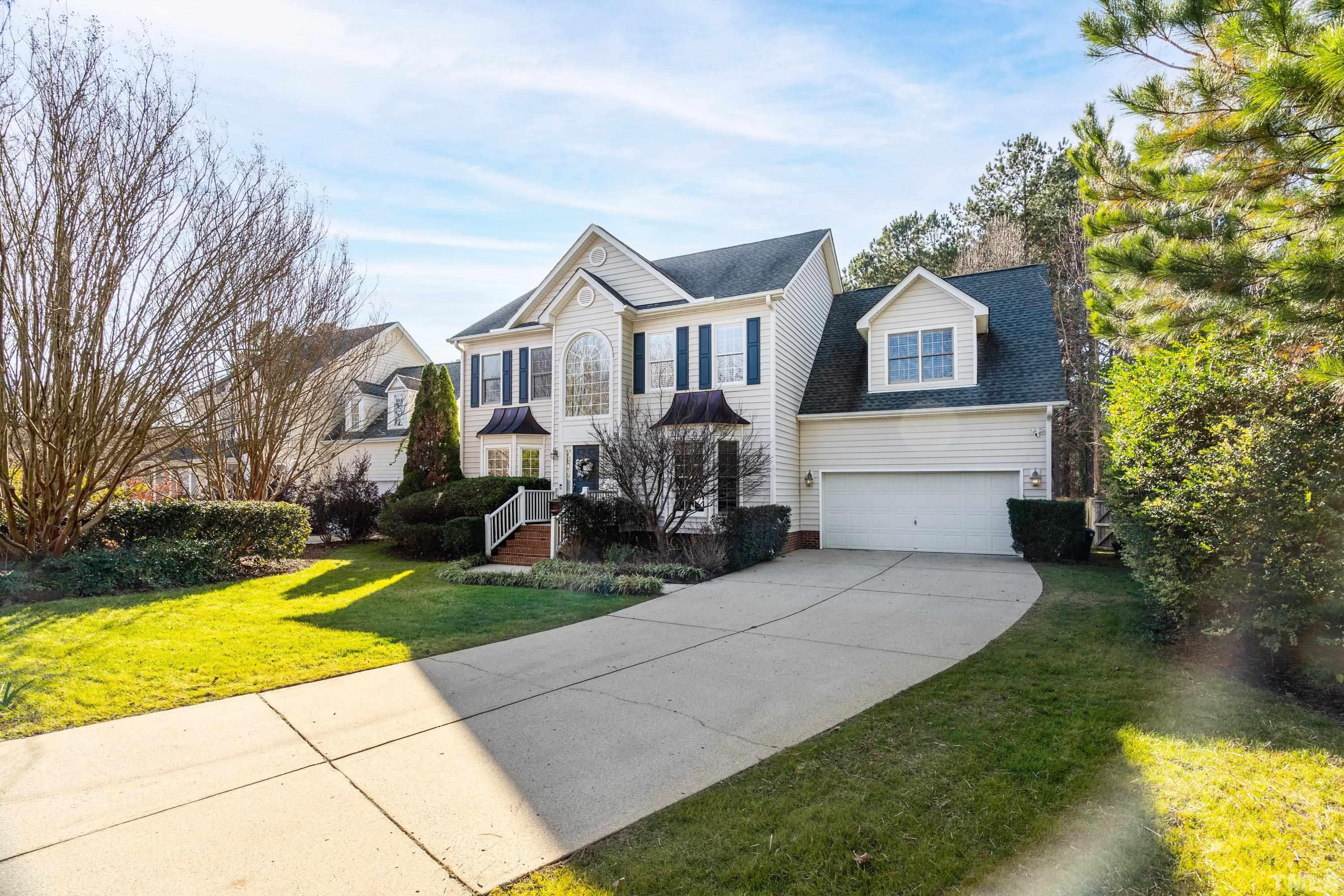 7405 Dorrington Trail Raleigh, NC 27615 - Photo 3 of 31 a front view of a house with garden