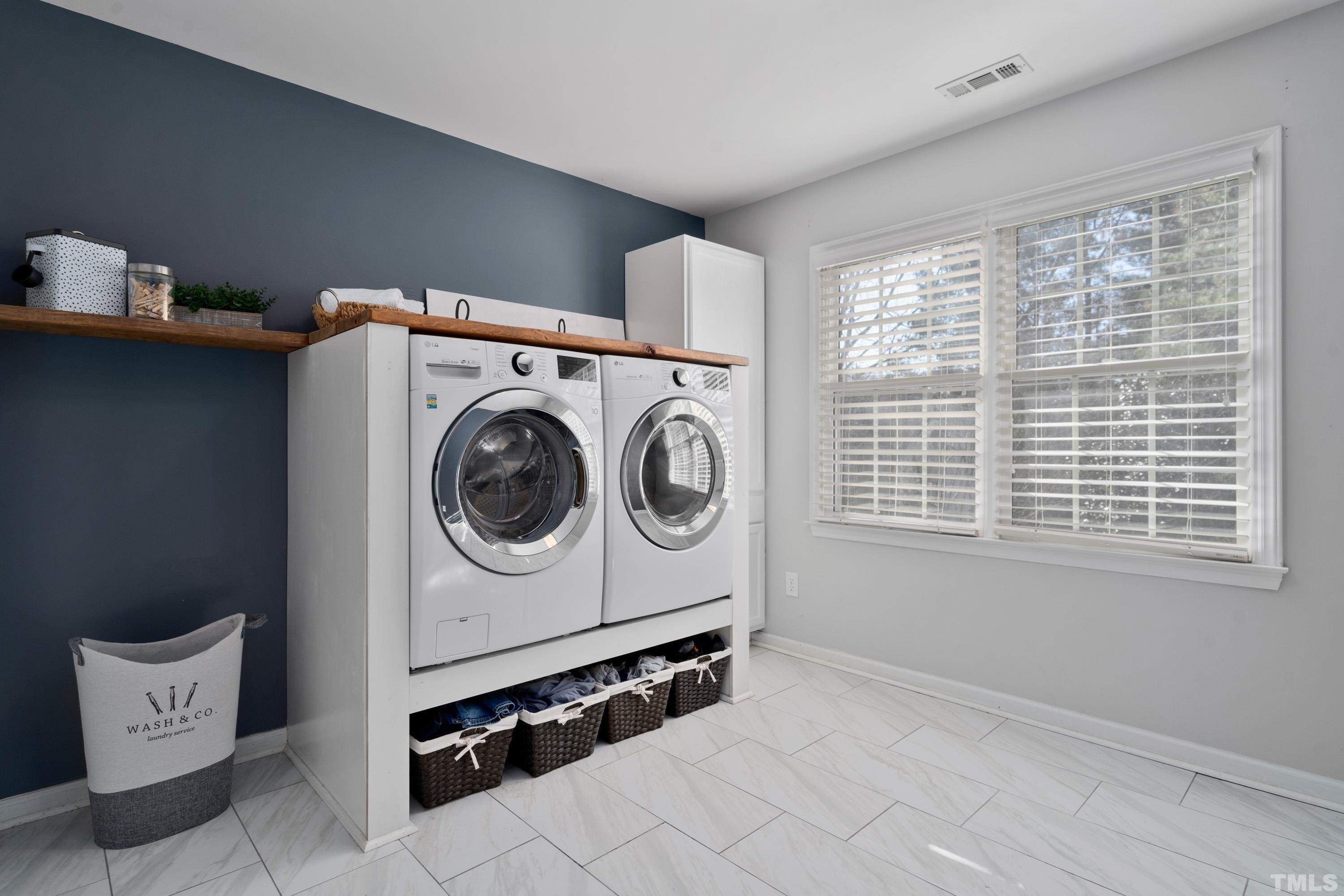7405 Dorrington Trail Raleigh, NC 27615 - Photo 21 of 31 a utility room with dryer and washer