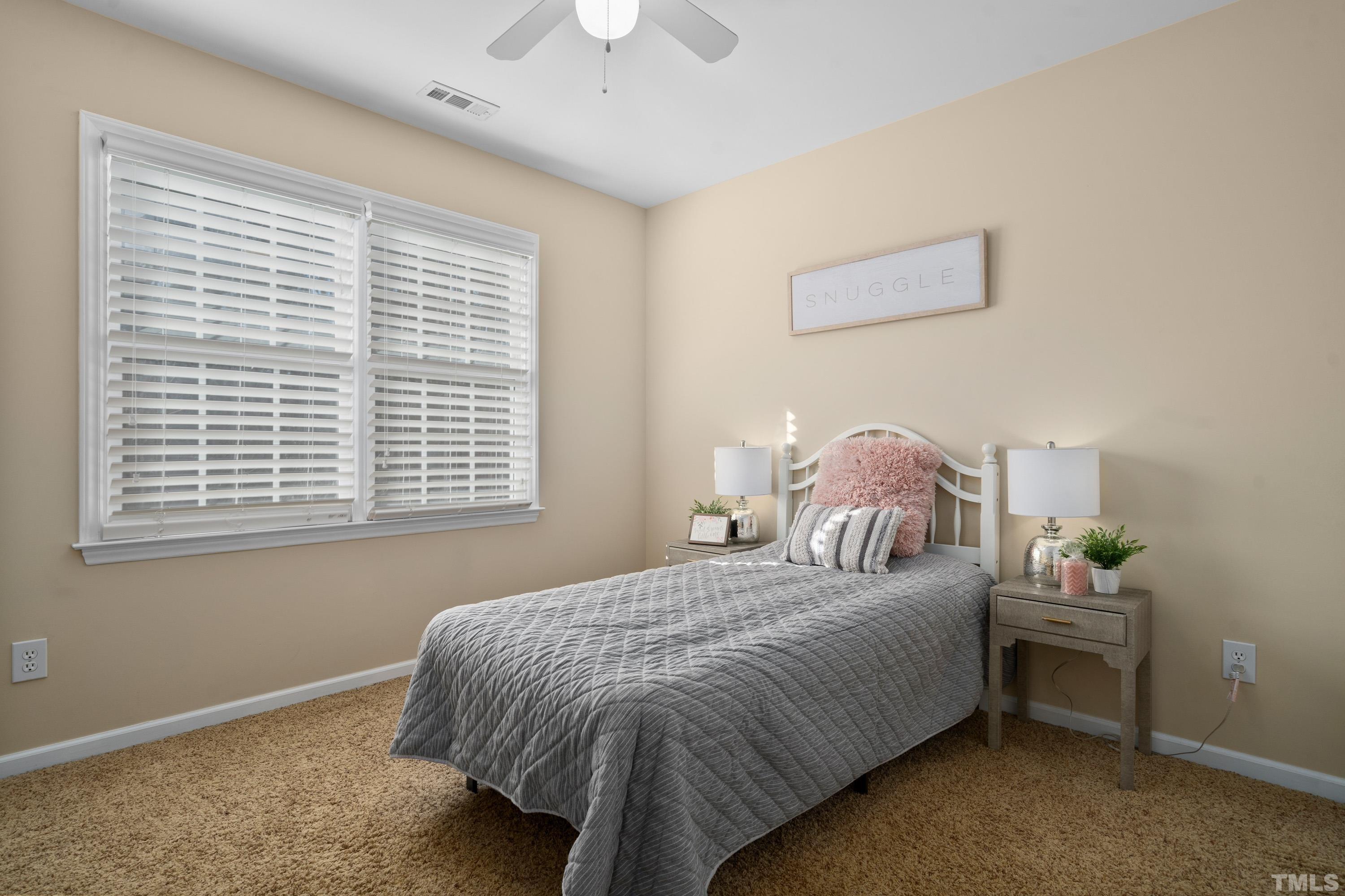 7405 Dorrington Trail Raleigh, NC 27615 - Photo 24 of 31 a bedroom with a bed and a window