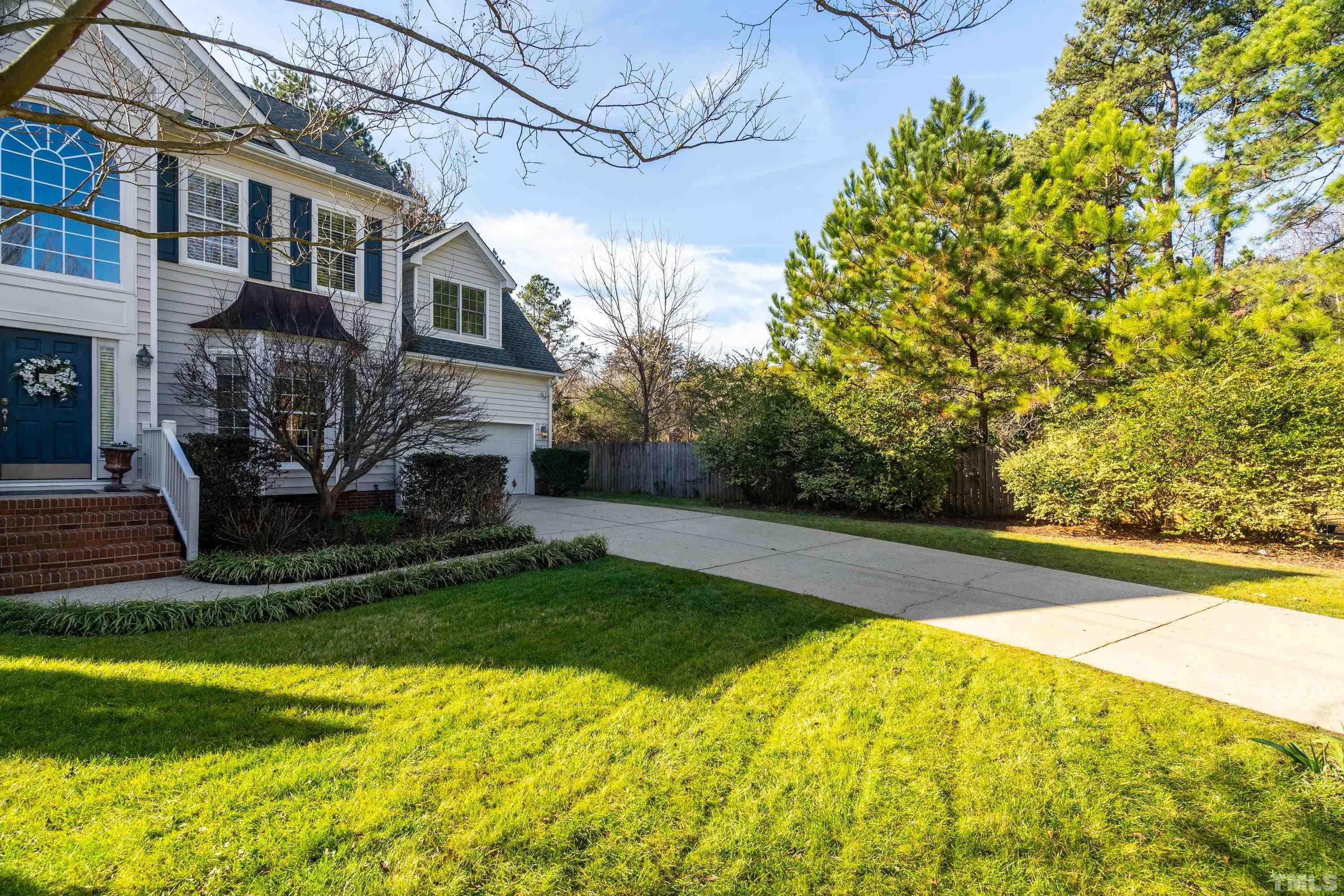 7405 Dorrington Trail Raleigh, NC 27615 - Photo 4 of 31 a view of a house with a yard