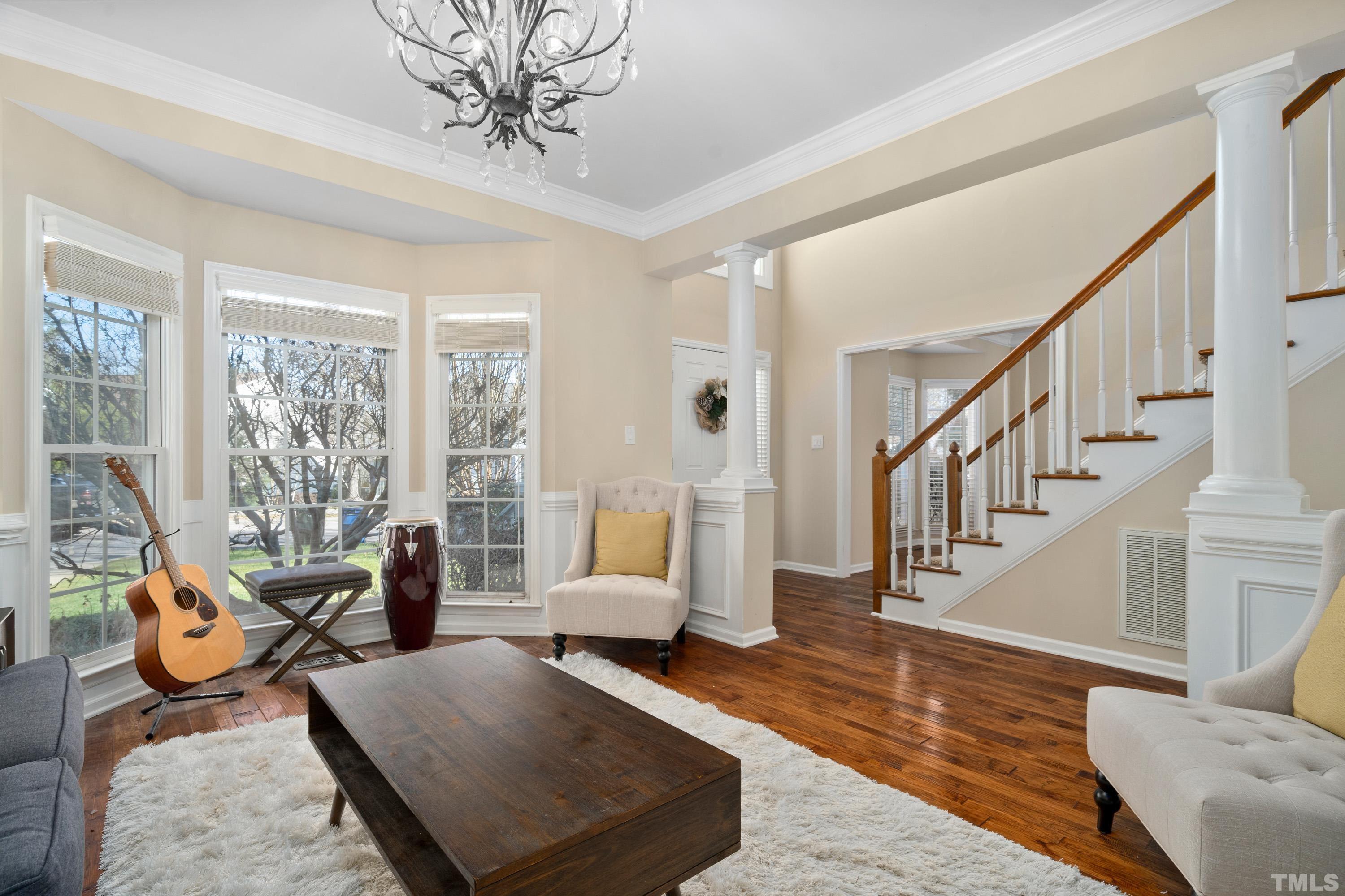 7405 Dorrington Trail Raleigh, NC 27615 - Photo 7 of 31 a living room with furniture or couch and a potted plant