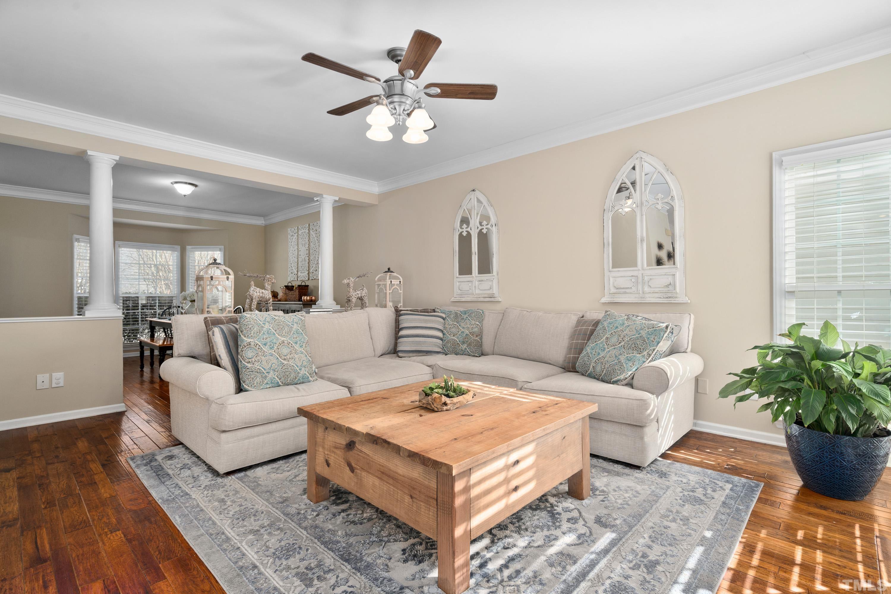 7405 Dorrington Trail Raleigh, NC 27615 - Photo 10 of 31 a living room with furniture potted plant and a window