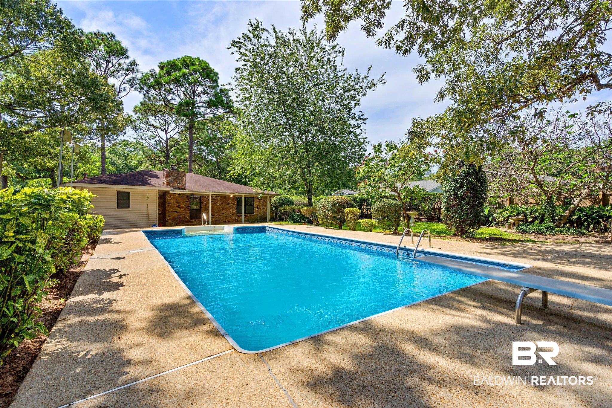 9623 Sunview Drive Semmes, AL 36575 - Photo 28 of 30 View of pool with a diving board and a patio