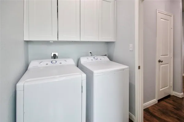 a utility room with dryer and washer