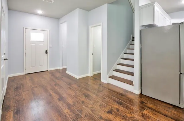 a view of entryway with wooden floor