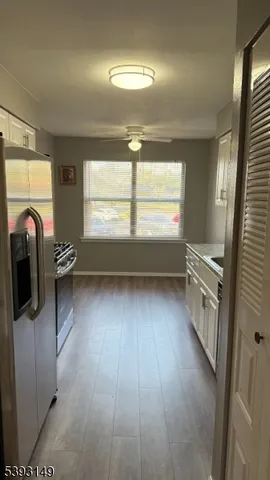 a view of a livingroom with a washer and dryer