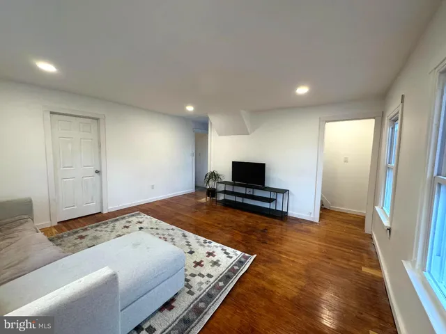 a bedroom with a bed and a television