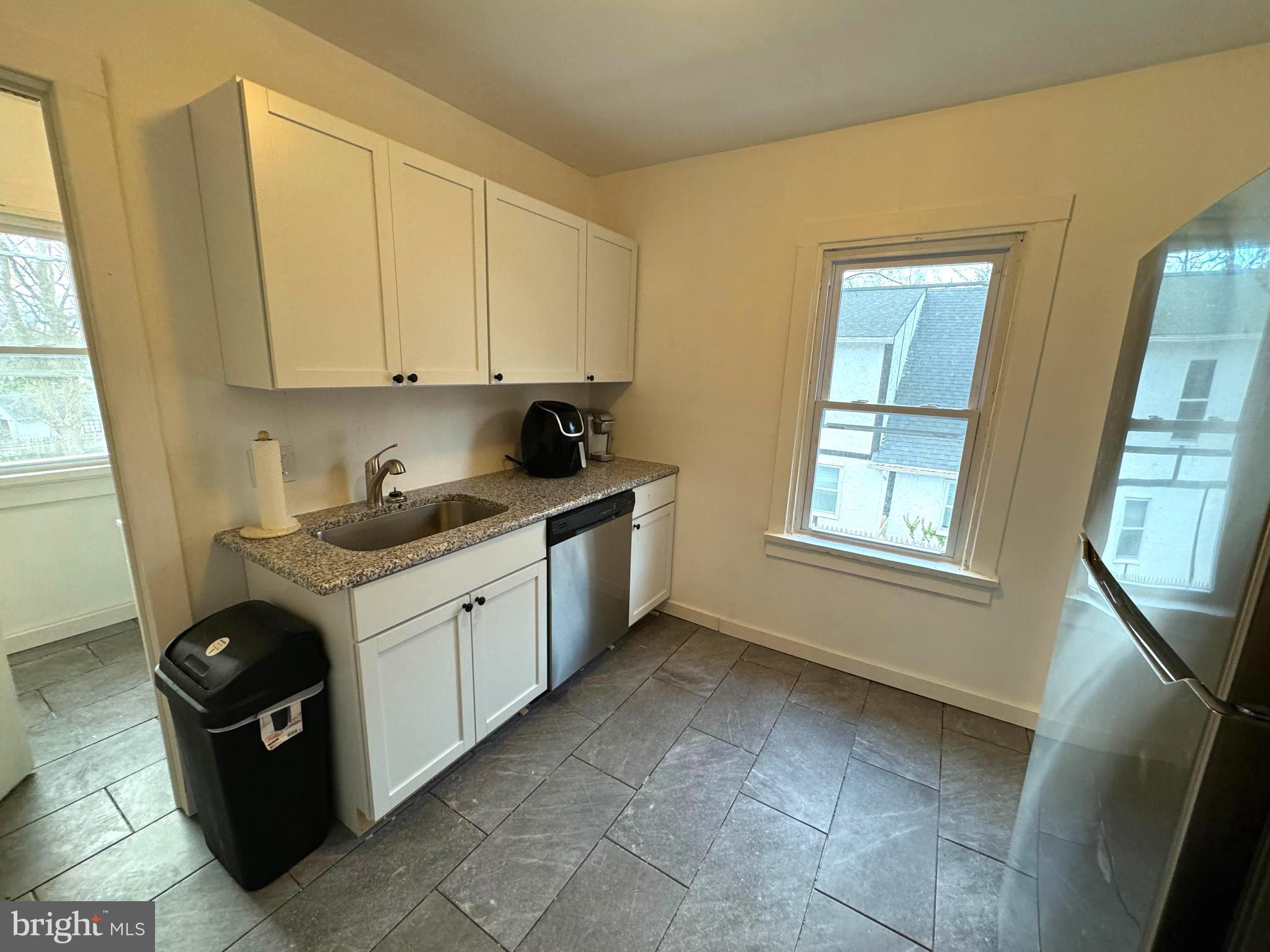 102 Montgomery Avenue, Unit A Pitman, NJ 08071 - Photo 6 of 9 a kitchen with a sink and cabinets