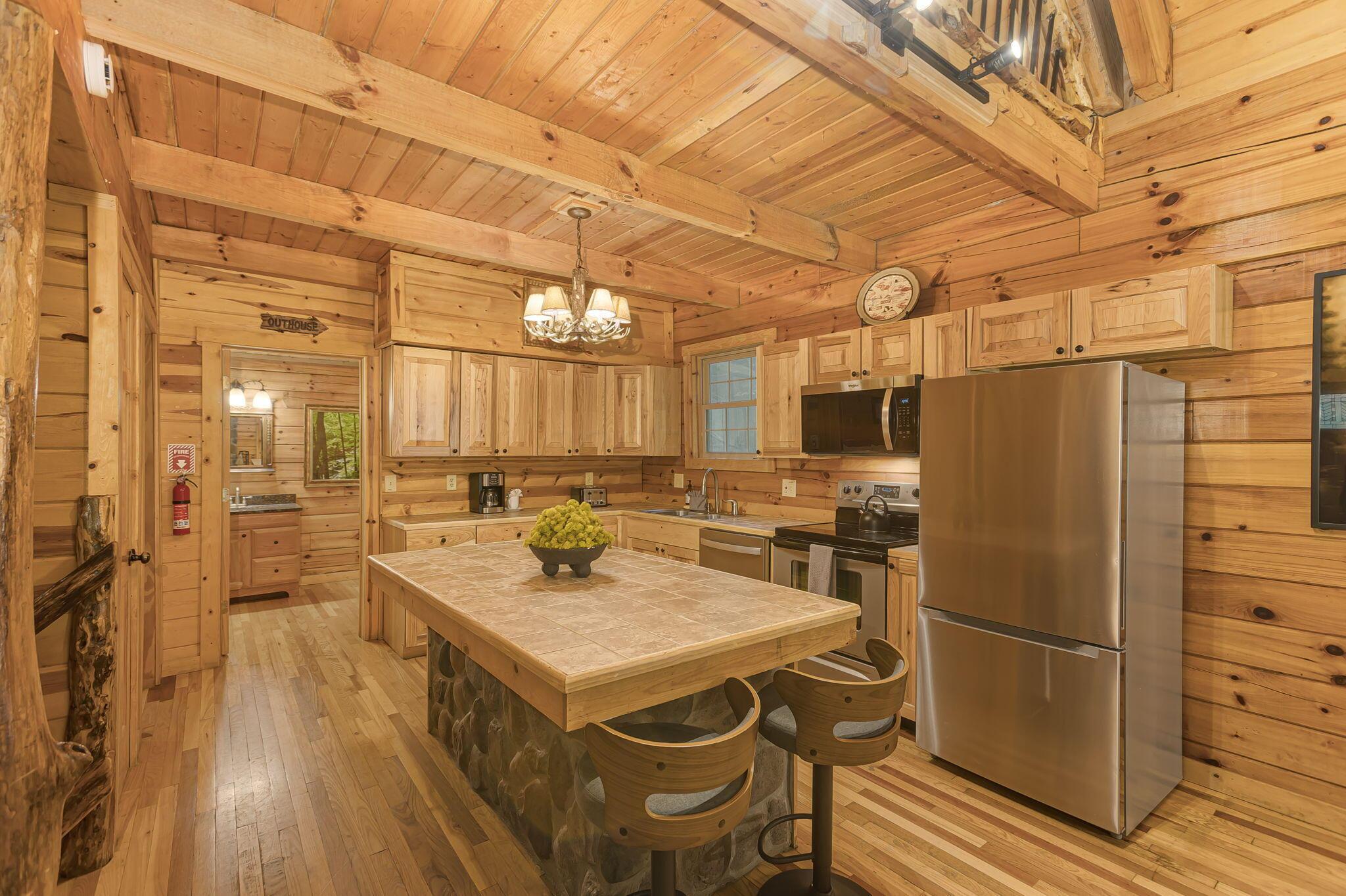 19475 Linden Road Logan, OH 43138 - Photo 18 of 94 Kitchen featuring, hardwood flooring, stainless steel appliances, stone-clad island with seating