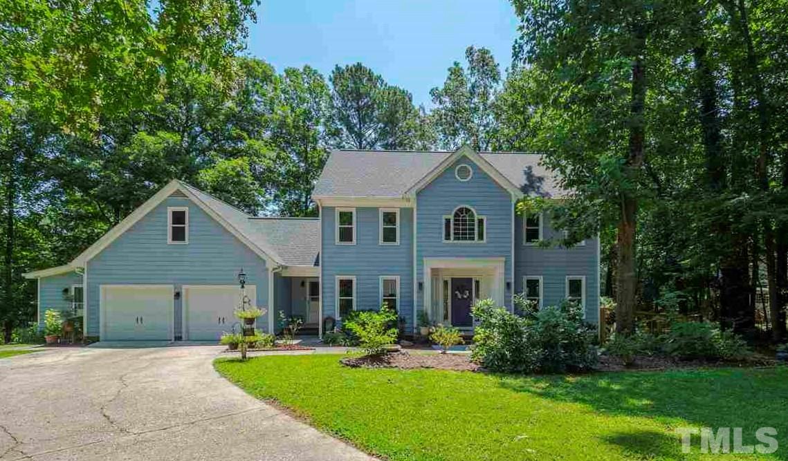 6108 Bur Trail Raleigh, NC 27616 - Photo 1 of 30 a front view of a house with a yard and trees