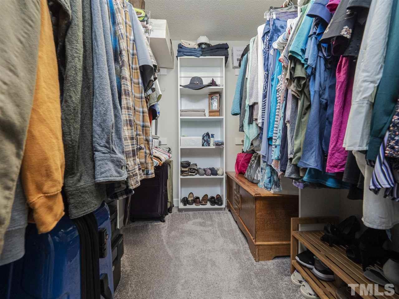 6108 Bur Trail Raleigh, NC 27616 - Photo 17 of 30 a view of walk in closet with clothes and shoes