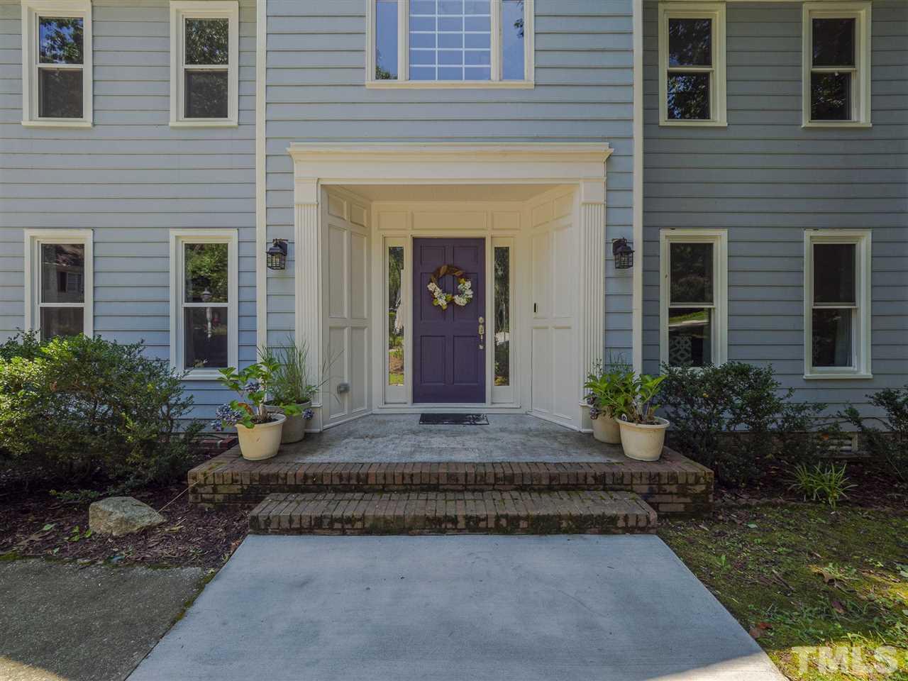 6108 Bur Trail Raleigh, NC 27616 - Photo 3 of 30 a front view of a house with garden