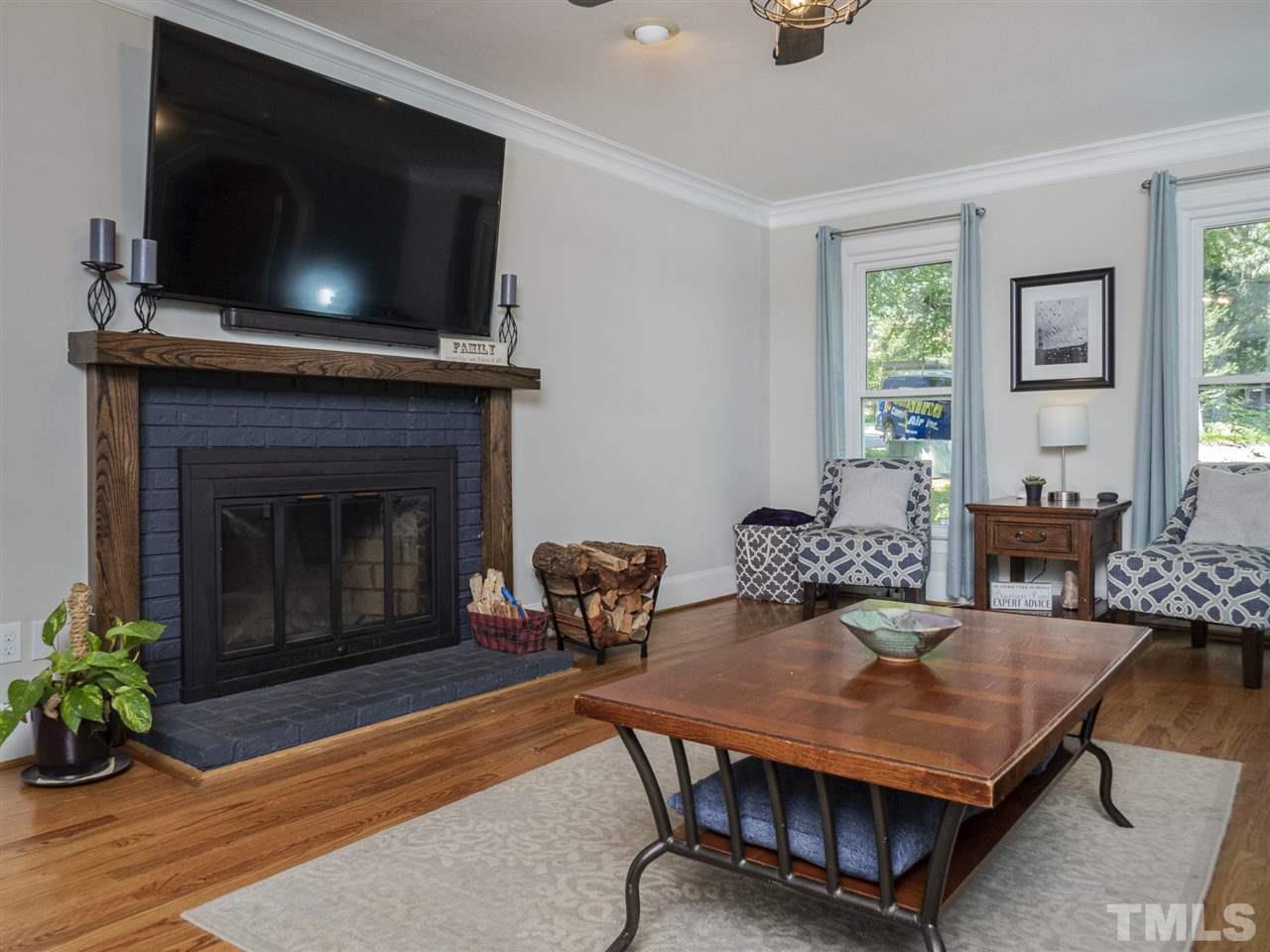 6108 Bur Trail Raleigh, NC 27616 - Photo 7 of 30 a living room with furniture and a fireplace