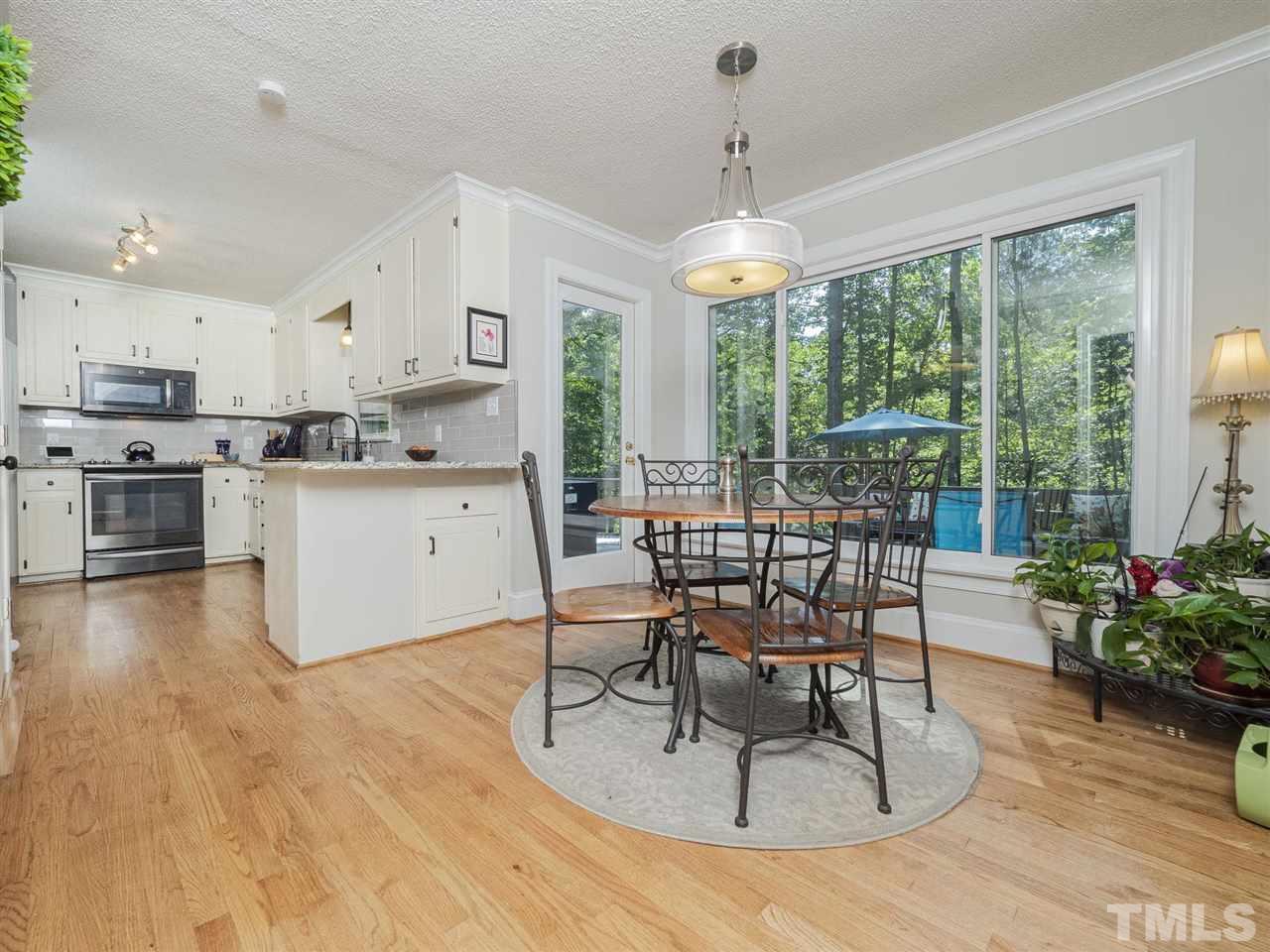 6108 Bur Trail Raleigh, NC 27616 - Photo 8 of 30 a view of a dining room with furniture window and outside view