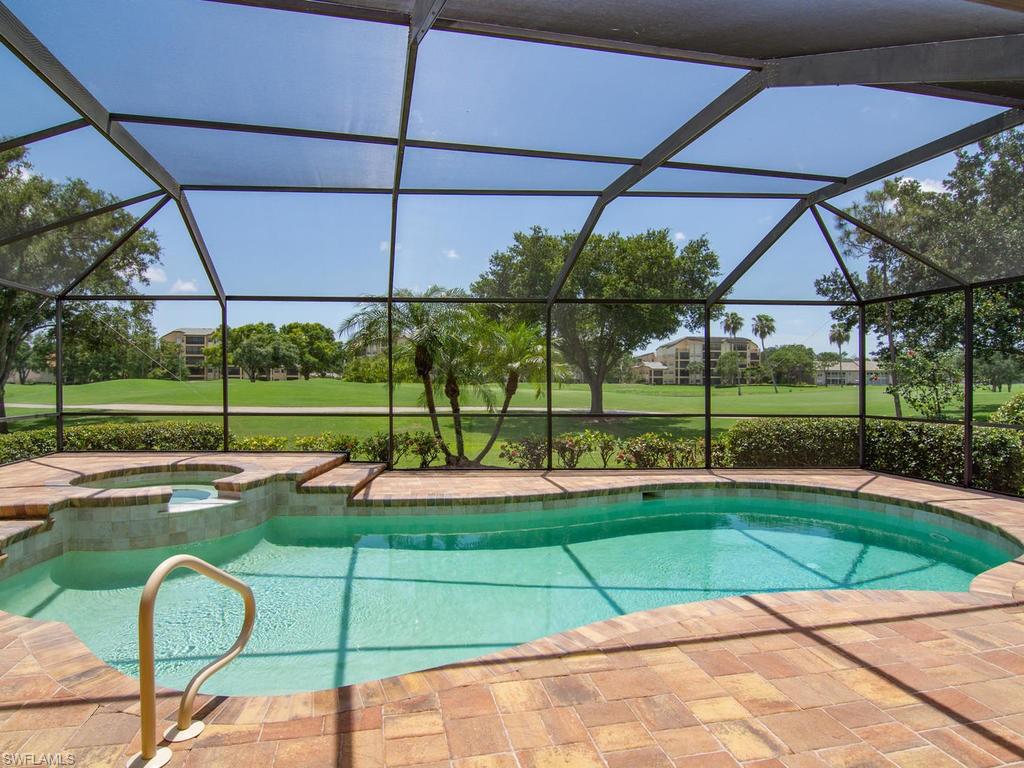 104 Napa Ridge Way Naples, FL 34119 - Photo 1 of 29 a view of a backyard with a swimming pool