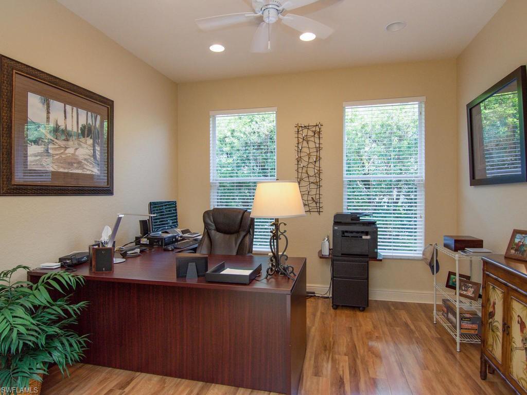 104 Napa Ridge Way Naples, FL 34119 - Photo 21 of 29 a view of a workspace with furniture and a window