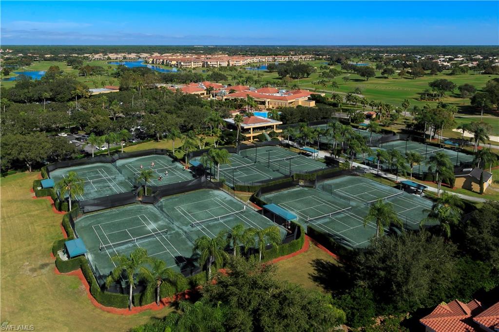 104 Napa Ridge Way Naples, FL 34119 - Photo 28 of 29 an aerial view of residential houses with outdoor space and trees