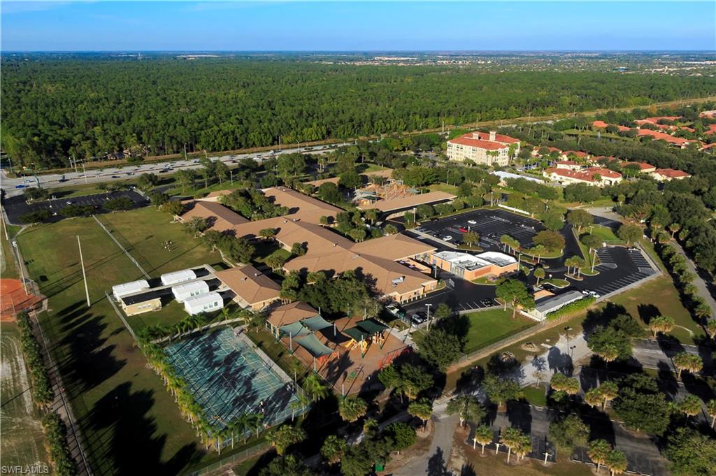 104 Napa Ridge Way Naples, FL 34119 - Photo 29 of 29 an aerial view of a city with lots of residential buildings