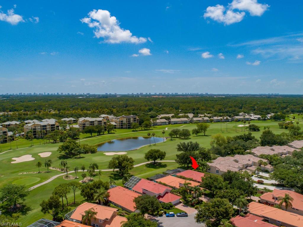104 Napa Ridge Way Naples, FL 34119 - Photo 6 of 29 an aerial view of residential houses with outdoor space and trees