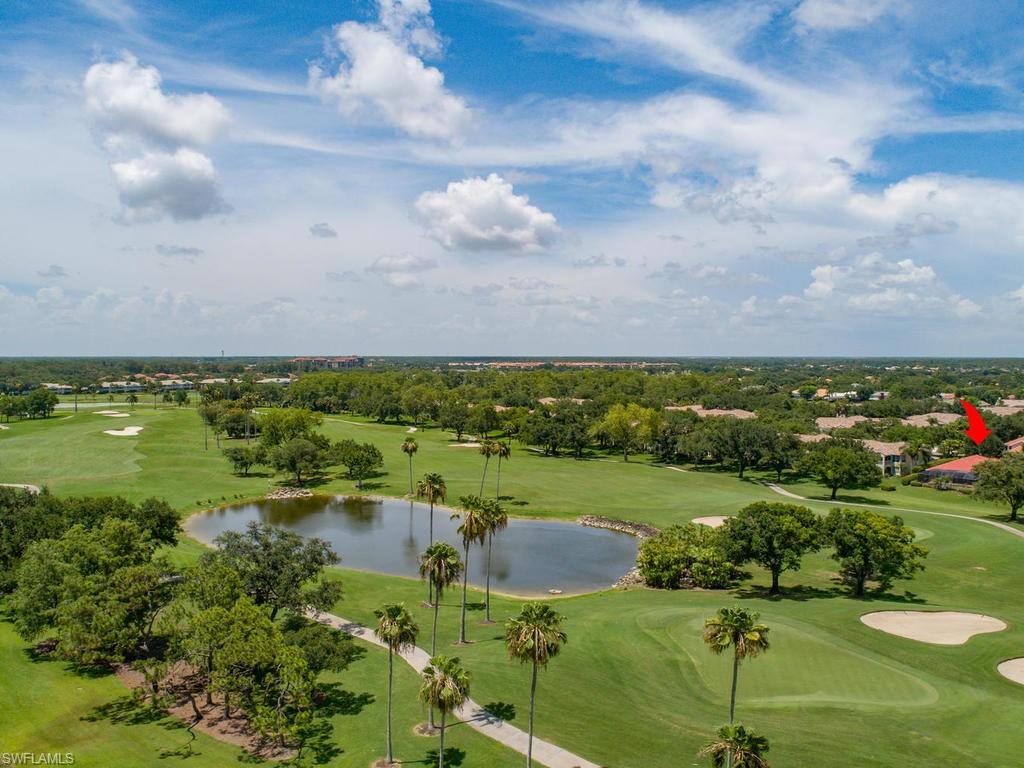 104 Napa Ridge Way Naples, FL 34119 - Photo 9 of 29 a view of a lake with a yard