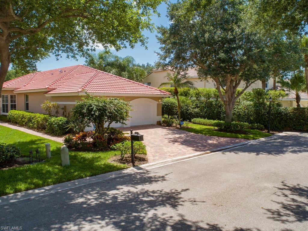 104 Napa Ridge Way Naples, FL 34119 - Photo 10 of 29 a front view of a house with garden