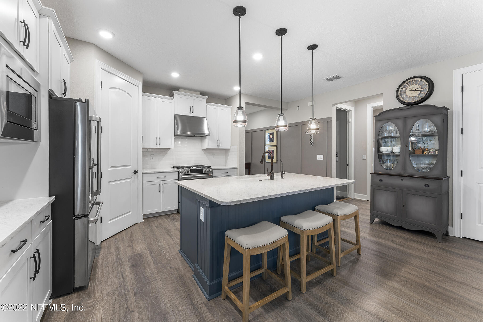 211 Orchard Lane St. Augustine, FL 32095 - Photo 11 of 59 a kitchen with stainless steel appliances a stove a sink a refrigerator and chairs