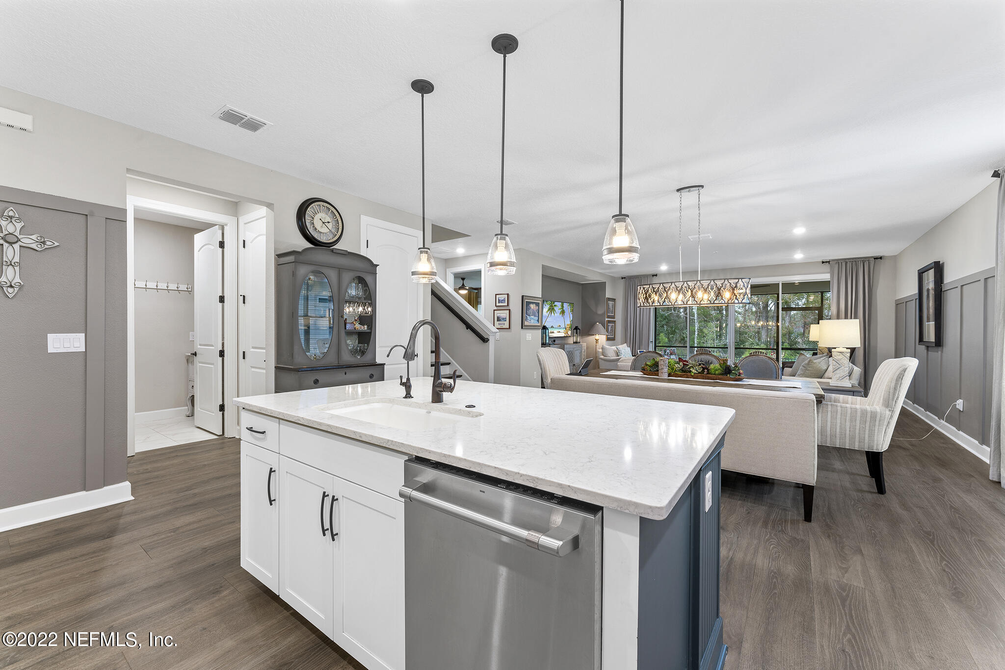 211 Orchard Lane St. Augustine, FL 32095 - Photo 14 of 59 a view of kitchen island with stainless steel appliances granite countertop sink and living room view