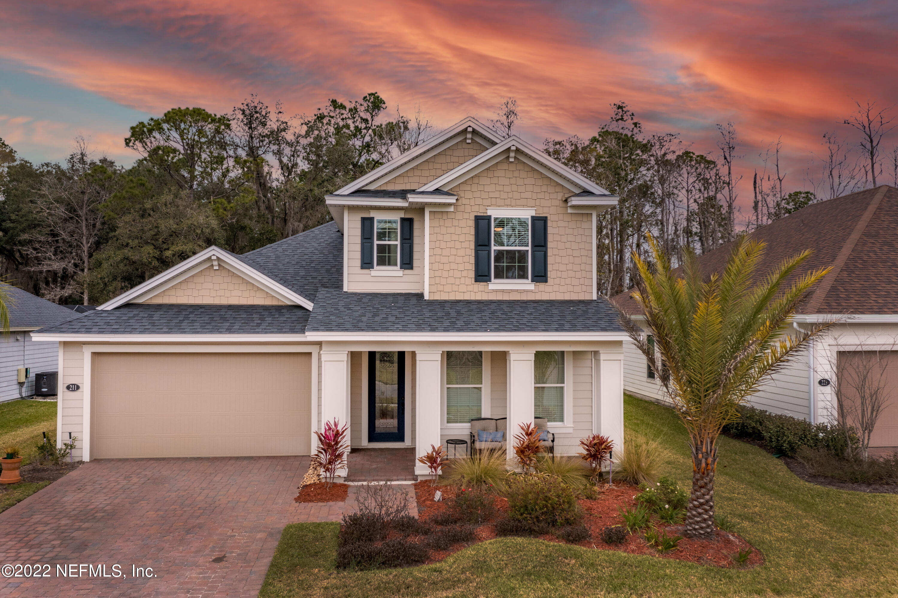 211 Orchard Lane St. Augustine, FL 32095 - Photo 2 of 59 a front view of a house with a yard