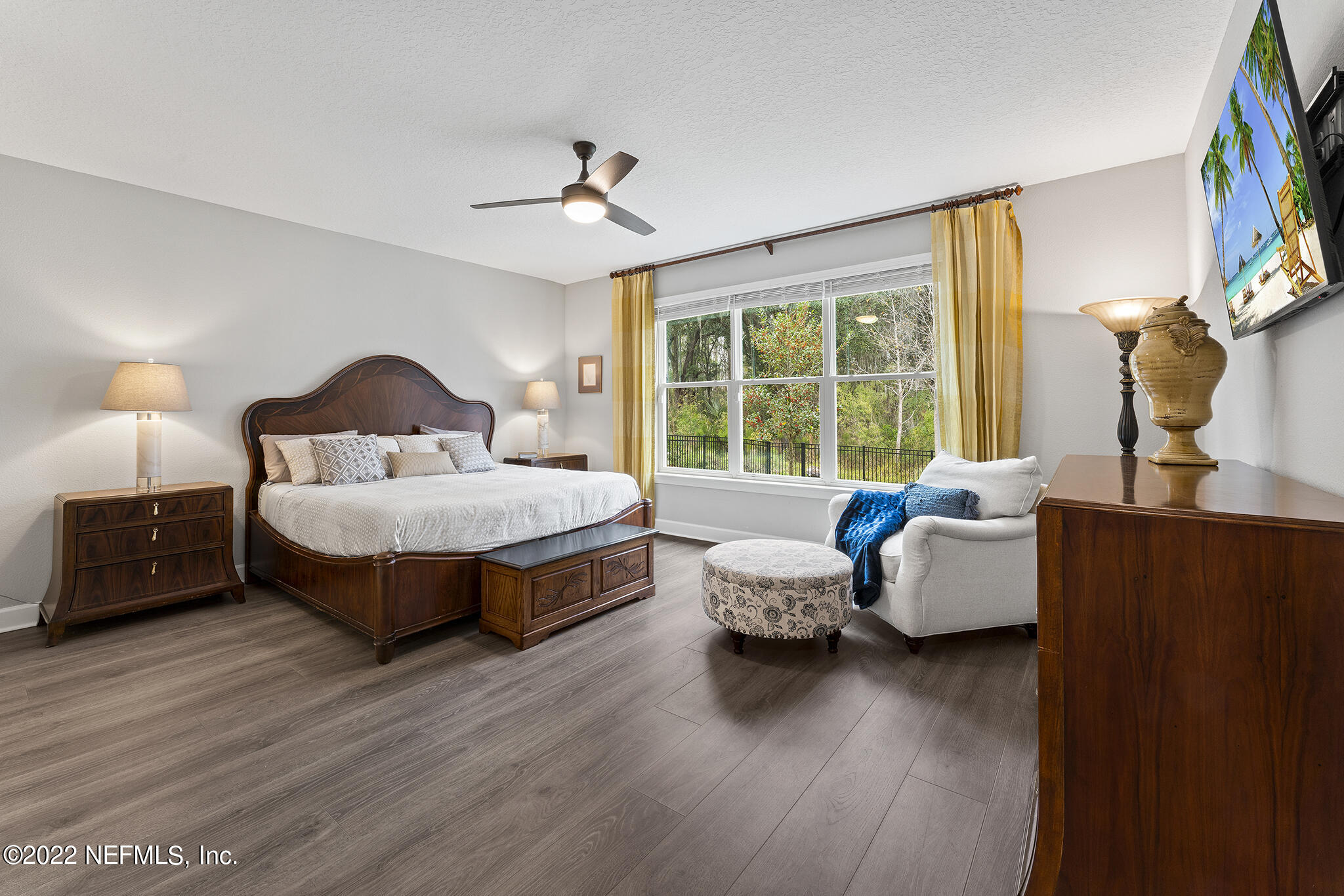 211 Orchard Lane St. Augustine, FL 32095 - Photo 23 of 59 a spacious bedroom with a bed and wooden floor