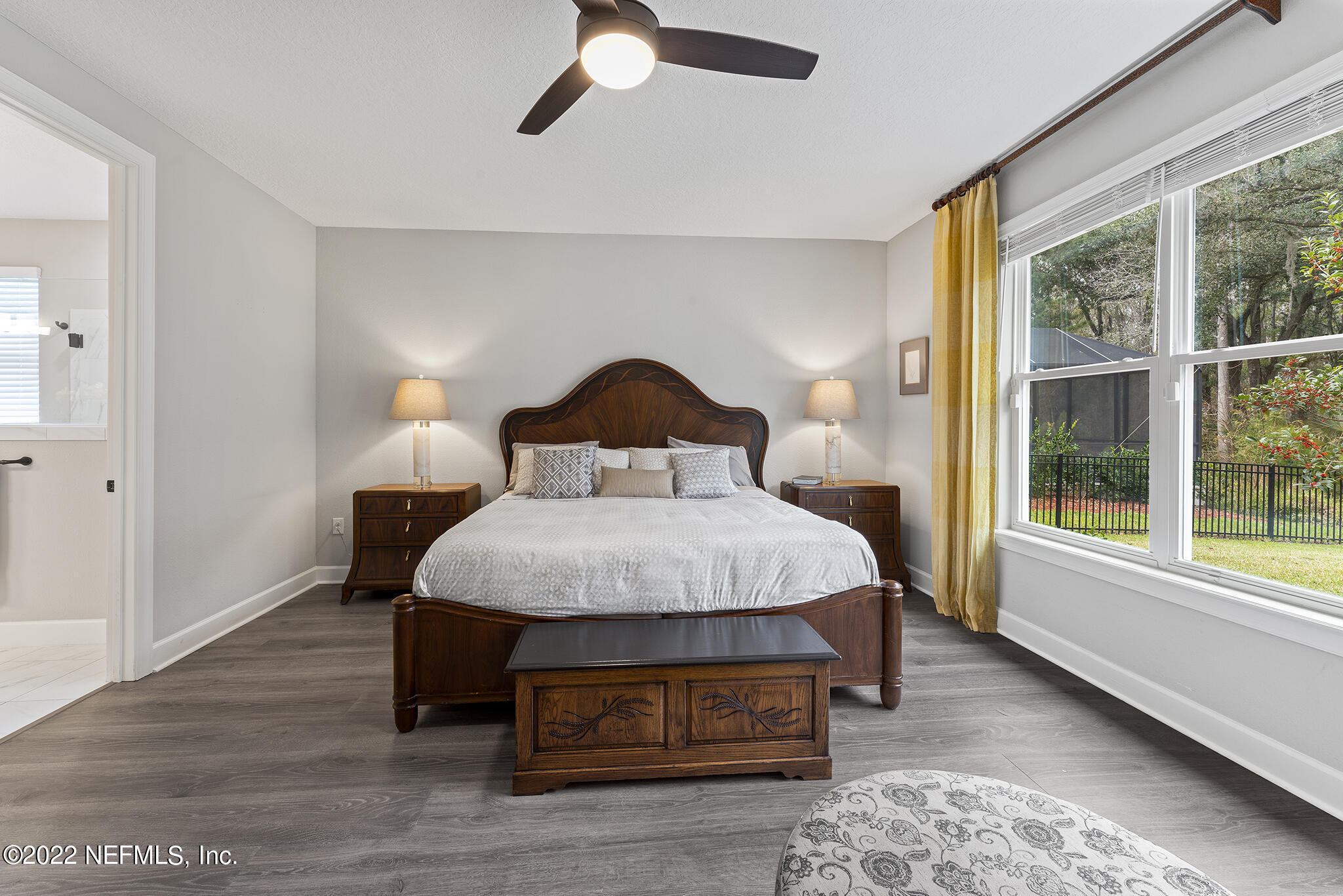 211 Orchard Lane St. Augustine, FL 32095 - Photo 24 of 59 a bedroom with a bed lamp and window