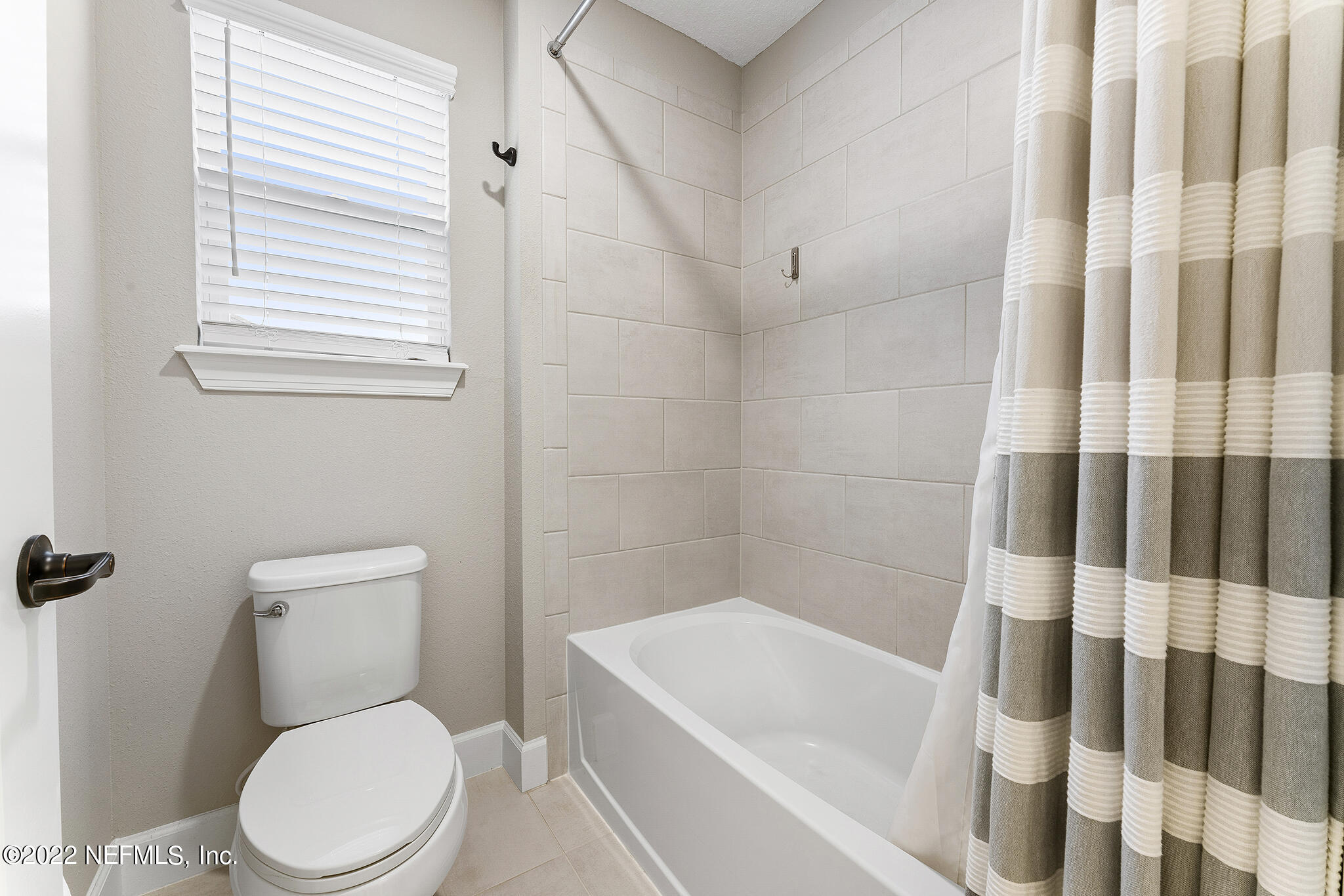 211 Orchard Lane St. Augustine, FL 32095 - Photo 36 of 59 a white toilet sitting next to a bath tub