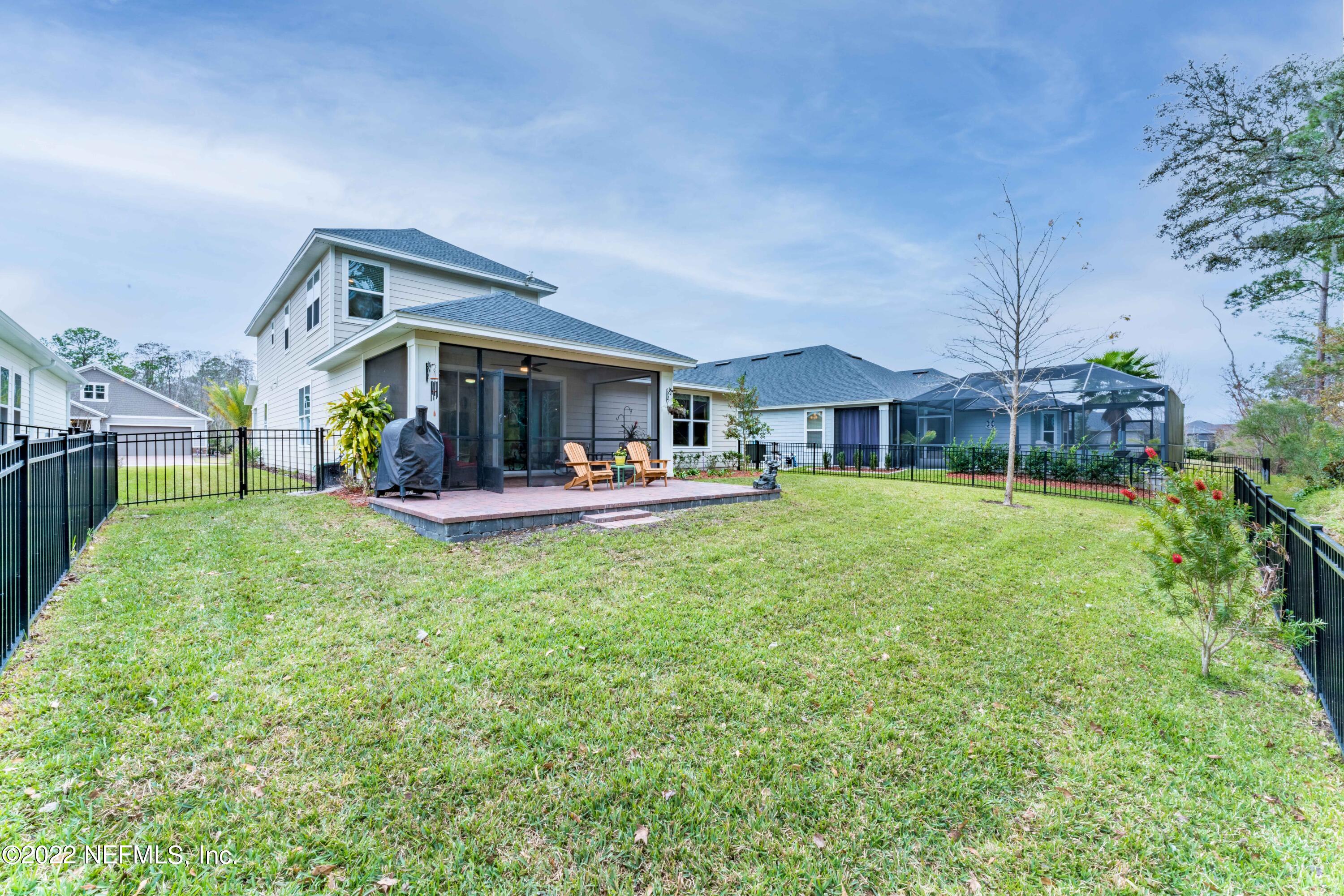 211 Orchard Lane St. Augustine, FL 32095 - Photo 45 of 59 a view of a house with a backyard porch and sitting area
