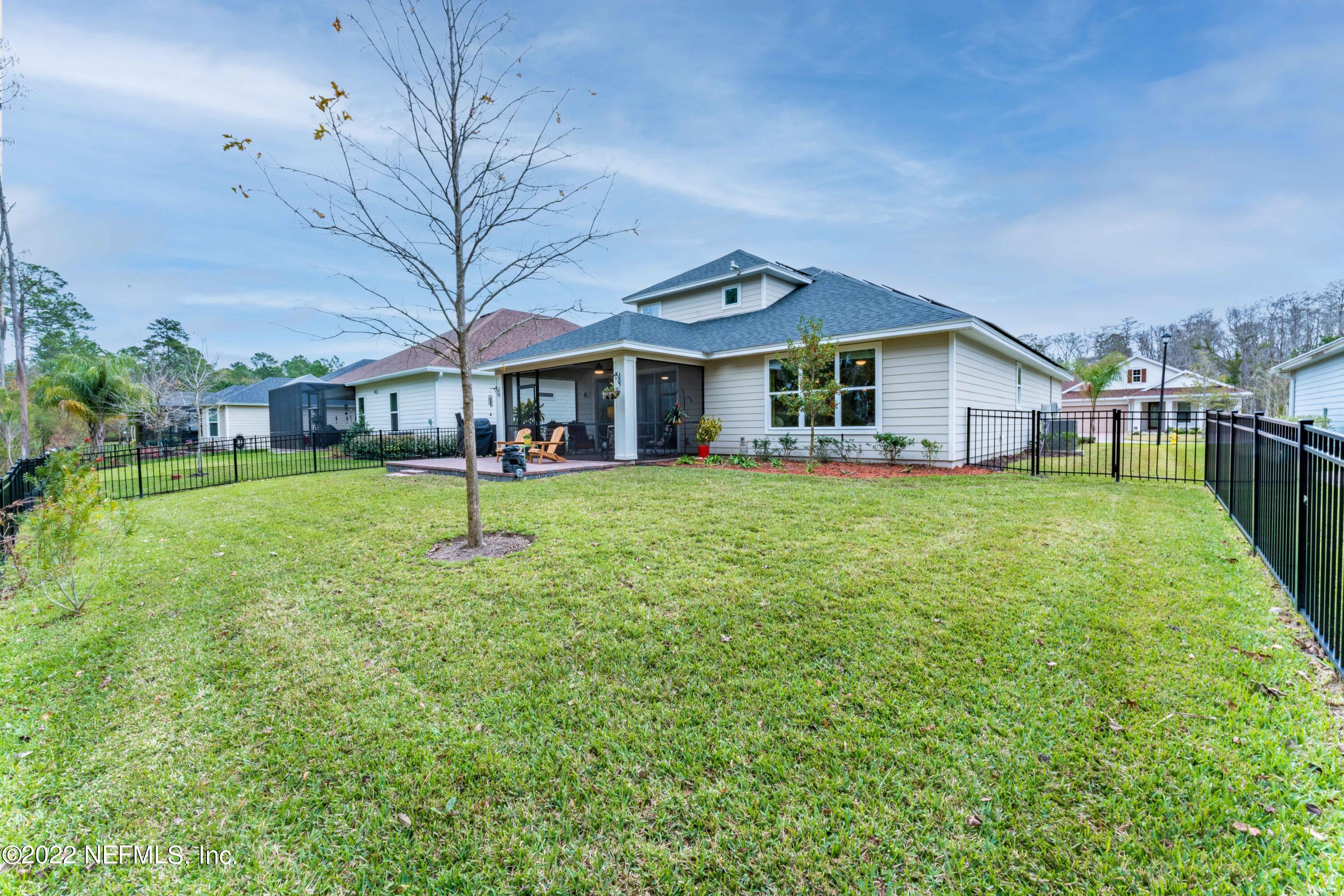 211 Orchard Lane St. Augustine, FL 32095 - Photo 46 of 59 a view of a house with a yard and sitting area