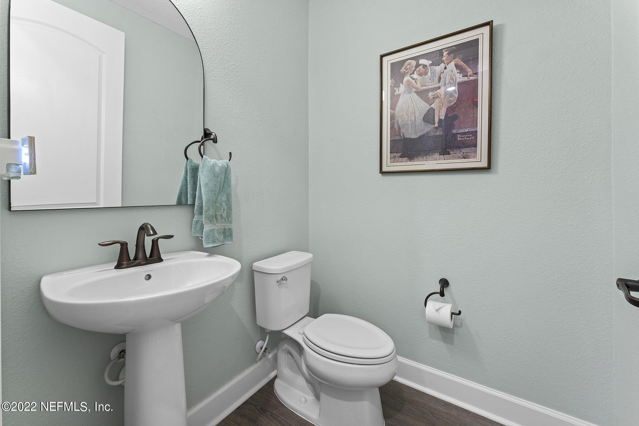 211 Orchard Lane St. Augustine, FL 32095 - Photo 9 of 59 a bathroom with a toilet sink and mirror