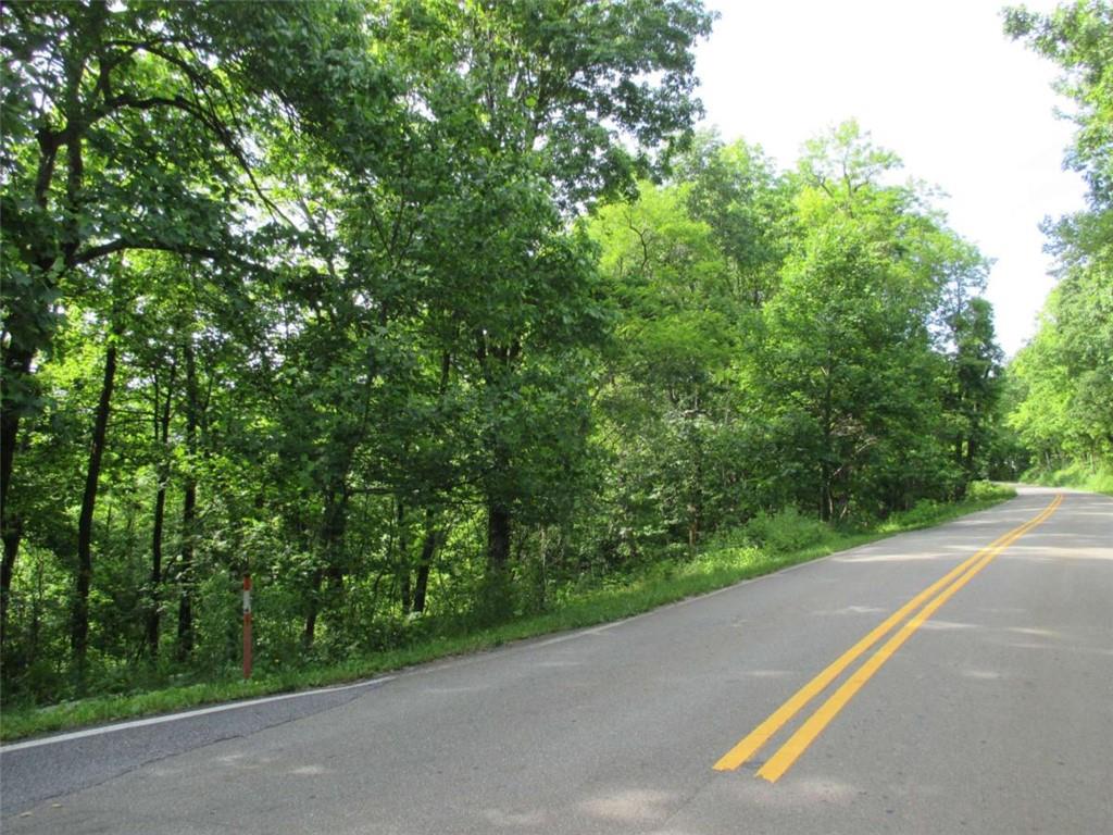 33 High Cliff Road Jasper, GA 30143 - Photo 10 of 22 a view of a street with a bench and trees