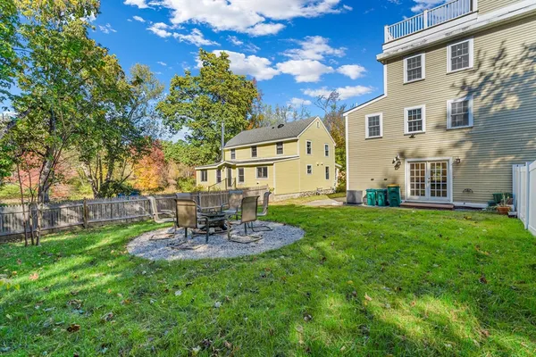 a view of a house with a backyard