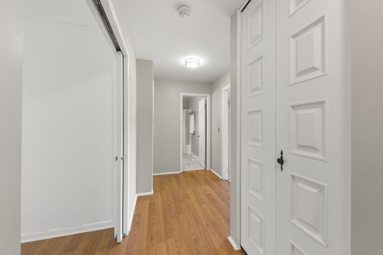 698 Circle Drive Roselle, IL 60172 - Photo 16 of 31 a view of a hallway with wooden floor and closet area