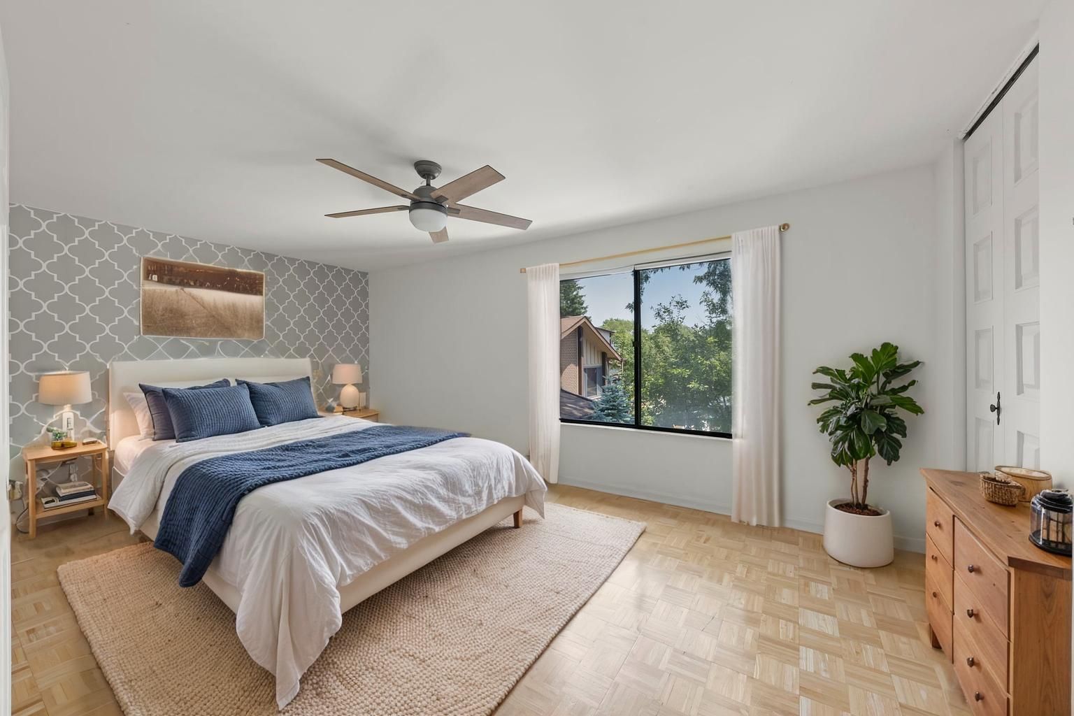 698 Circle Drive Roselle, IL 60172 - Photo 17 of 31 a spacious bedroom with a bed and a potted plant