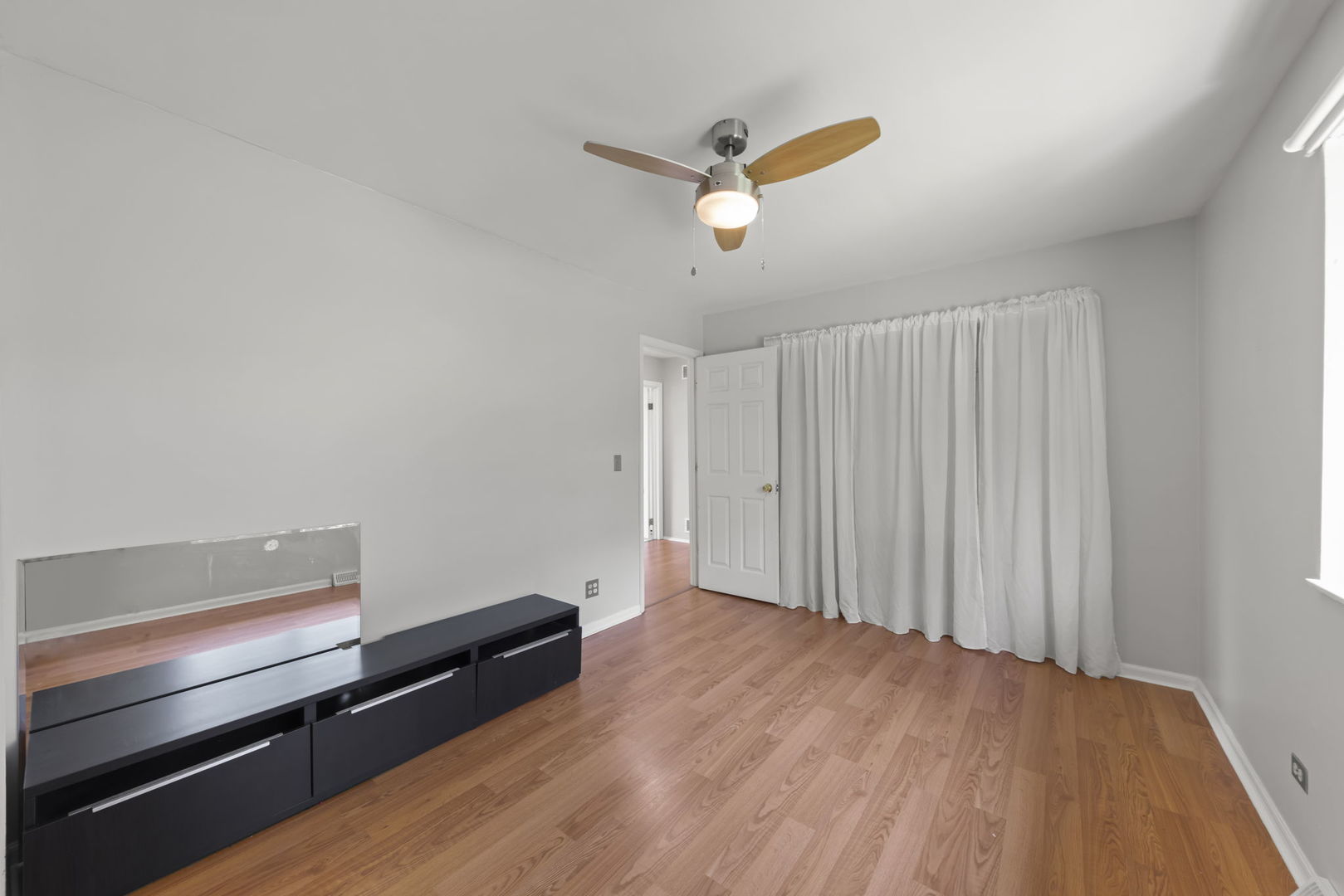698 Circle Drive Roselle, IL 60172 - Photo 23 of 31 a view of room with wooden floor and white walls