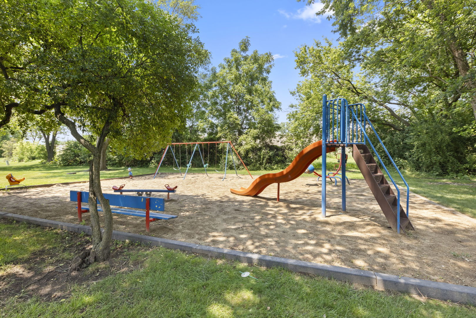 698 Circle Drive Roselle, IL 60172 - Photo 27 of 31 a view of park with swings
